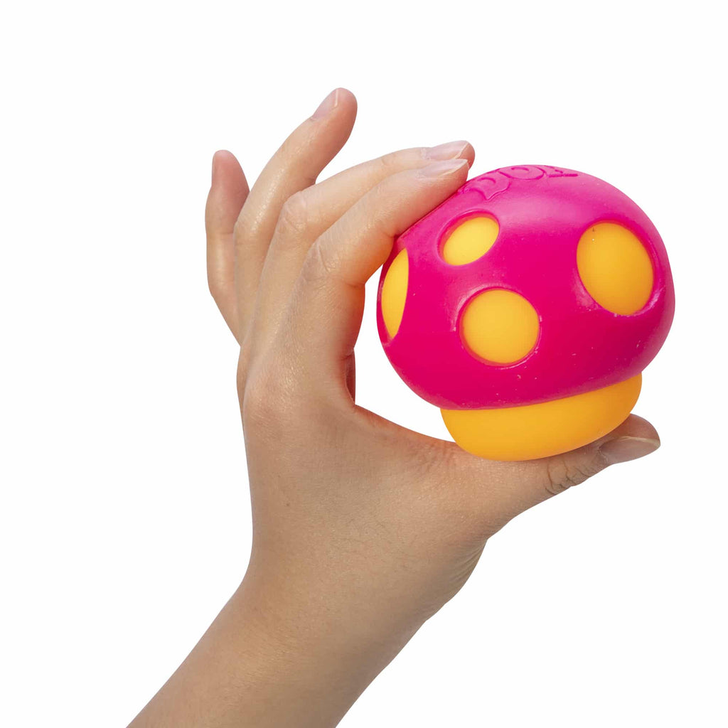 NeeDoh Groovy Shroom - Hand Holding Orange with Pink Top Mushroom